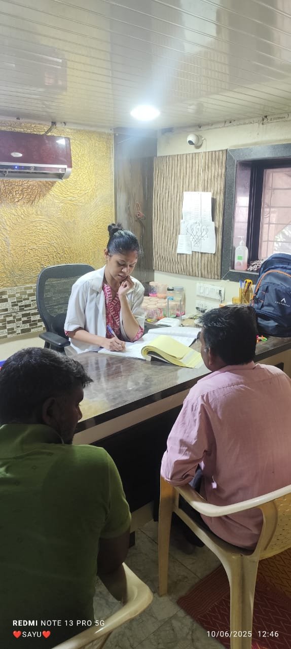 A doctor consulting truck drivers at a Suraksha Clinic OPD camp